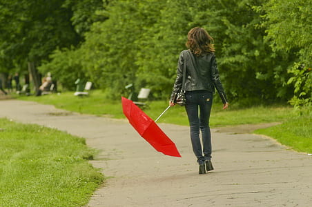 woman holding red umbrella thumbnail
