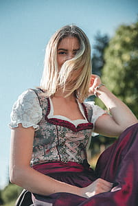 Woman Wearing Maroon And White Floral Dress thumbnail