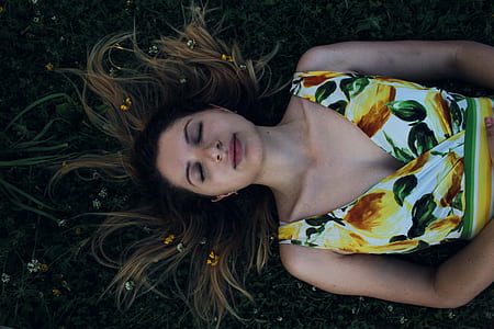 woman lying on green grass thumbnail