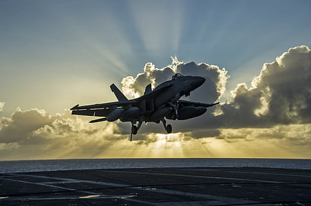 black and white airplane about to land on gray surface thumbnail