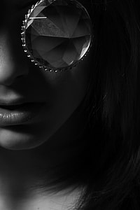 black and white photo of woman with diamond in her eyes thumbnail