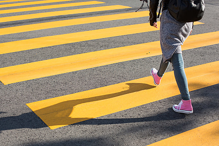 Girl Crossing Street on a Yellow Crosswalk thumbnail