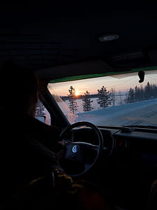 person driving Volkswagen vehicle during sunset thumbnail