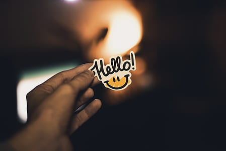 person holding hello signage thumbnail