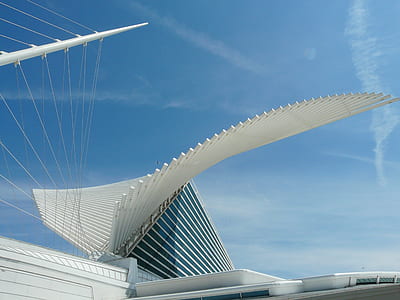 photo of white building under blue sky thumbnail