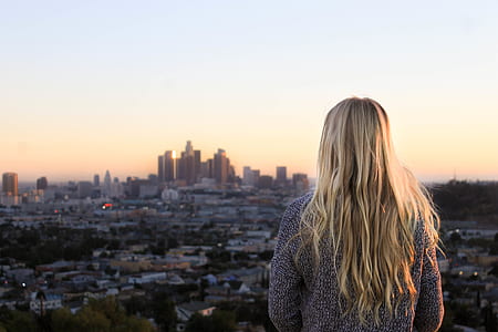 selective focus photo of woman looking city thumbnail