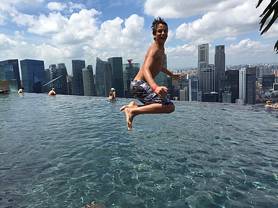 boy jumping on pool thumbnail