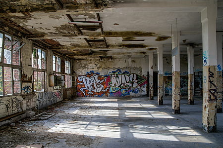 graffiti on wall inside abandoned building thumbnail