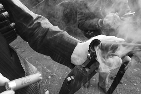 Person Releasing Shotgun Shell on Shotgun thumbnail