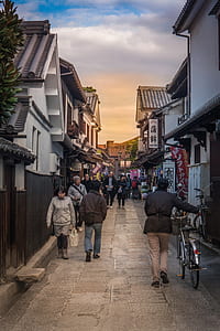people walking in the street between architectures thumbnail