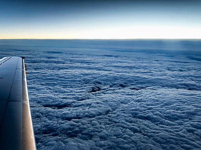 gray airplane displaying clouds thumbnail