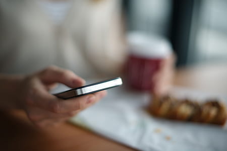 person holding phone thumbnail