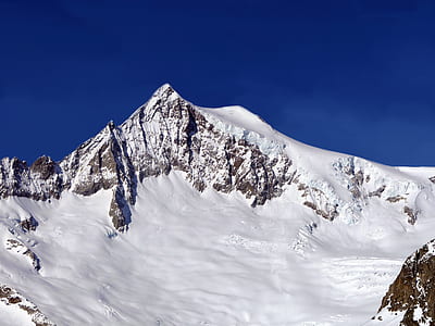 snow cover mountain during clear sky thumbnail
