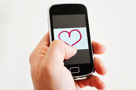 black smartphone showing red heart illustration thumbnail