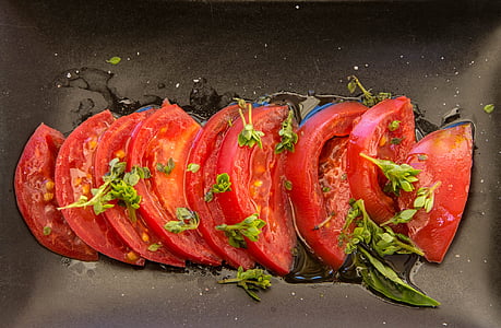 slices of tomatoes on plate thumbnail