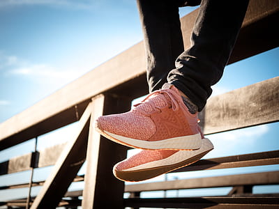 person sitting on brown wooden rail thumbnail