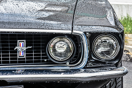 close-up photo of classic black Ford Mustang coupe at daytime thumbnail