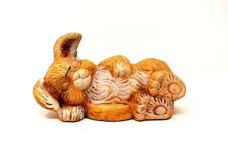 brown ceramic rabbit figurine on top of white surface thumbnail
