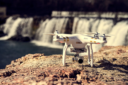 white and gold DJi Phantom quadcopter thumbnail