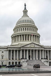 Capitol Hill with black SUVs. thumbnail