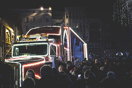 Photography of People Gathered Beside Coca-cola Truck during Nighttime thumbnail