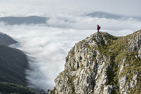 Photography of Person on Green Mountain thumbnail