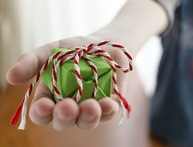 person holding small gift box thumbnail