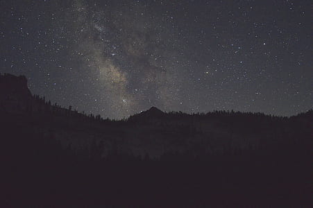 silhouette of mountain under stars at daytime thumbnail