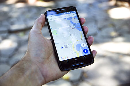 person holding turned-on black Android smartphone thumbnail