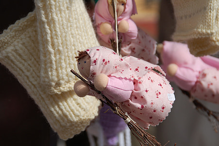 close-up photo of doll on brown stick thumbnail
