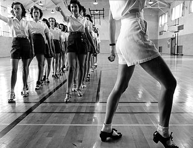 grayscale photo of women doing dance gesture thumbnail