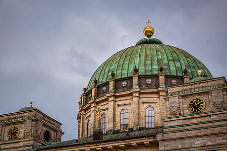 brown and green cathedral under the cloudy sky thumbnail