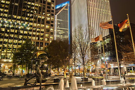 gray buildings near fountain at nighttime thumbnail