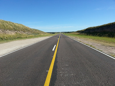 road under blue sky thumbnail