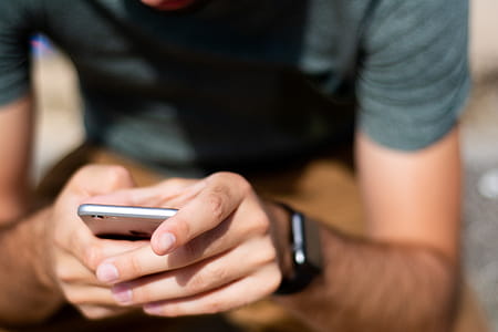 Man Holding Iphone thumbnail