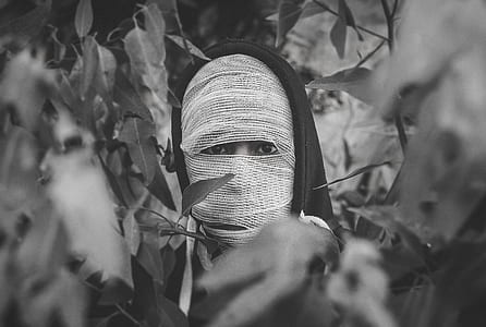 grayscale photography of person covered with mask thumbnail