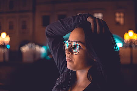 selective focus photography of woman holding her head thumbnail