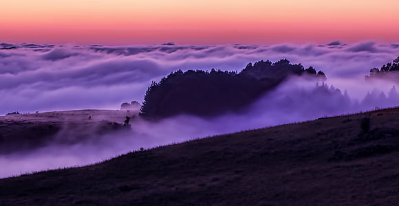 mountain covered with white clouds during daytime thumbnail
