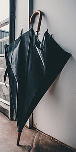 water droplets on black folding umbrella thumbnail
