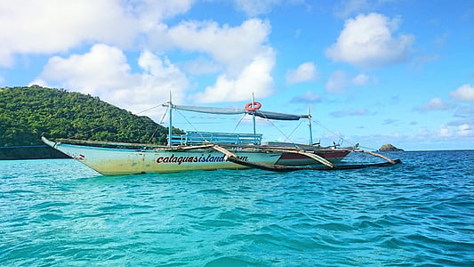white and black boat in body of water thumbnail