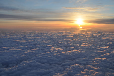white clouds under gray sky during golden hour thumbnail