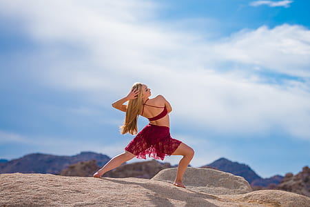 woman in red dress on sand thumbnail