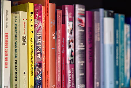 selective focus photography of books on shelf thumbnail