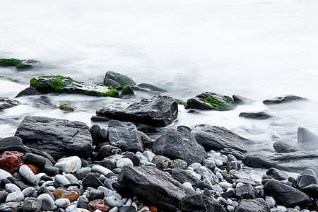 Brown Rock Beside Body of Water thumbnail