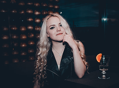 woman in black leather sleeveless shirt thumbnail