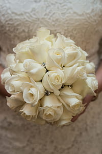 woman holding white rose bouquet thumbnail
