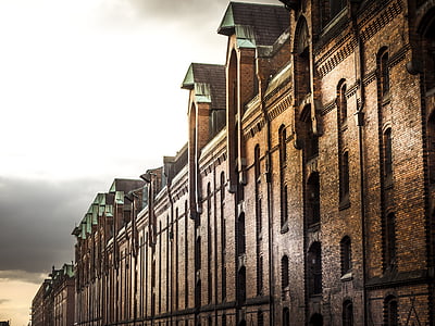 brown concrete building under white sky thumbnail