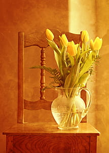 clear glass pitcher with flowers thumbnail