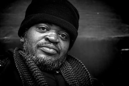 grayscale photo of man wearing beanie thumbnail