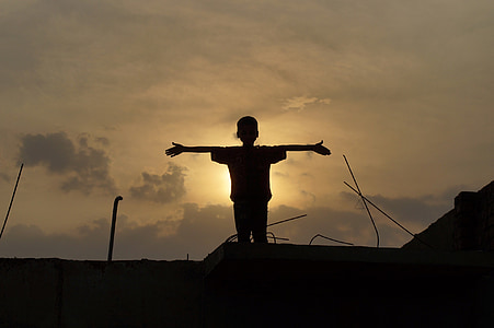 boy in black top photo during sunset thumbnail